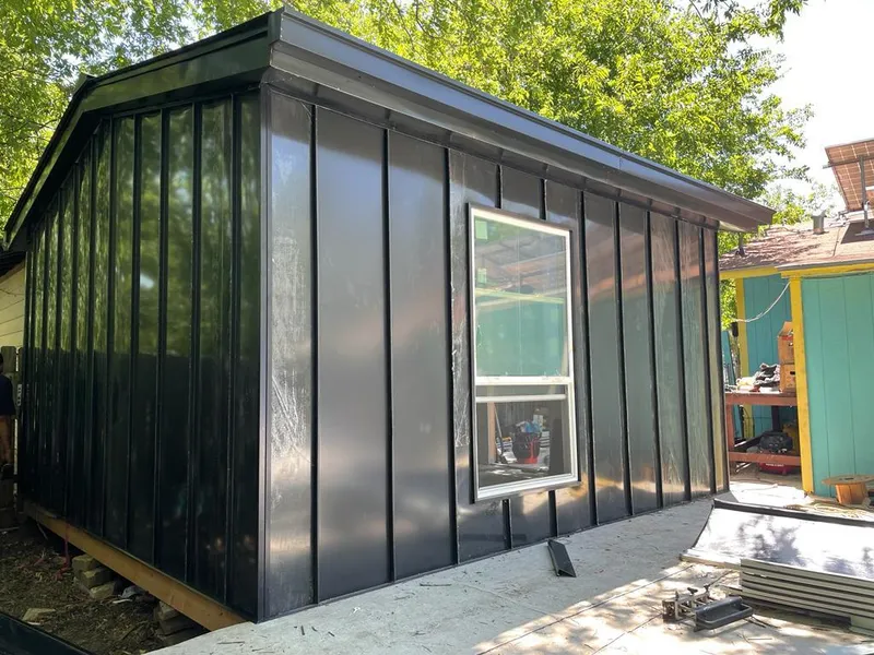 Black standing seam metal wall panels for Roof Inspection in Doney Park
